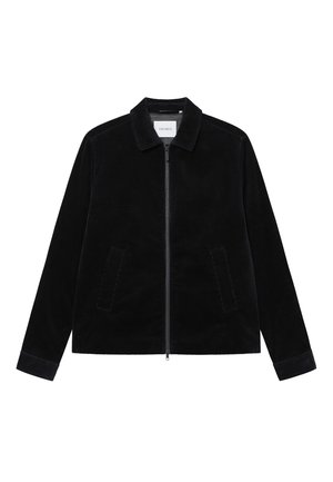 Svart corduroyjacka med krage, framdragkedja och två sidofickor. Har ett strukturerat tyg och kontrasterande manschetter.