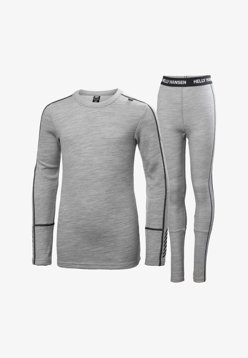 Šedá sada termo trička a legín. Tričko má dlouhé rukávy, kulatý výstřih a černé detaily; legíny mají pružný pas a boční pruhy.