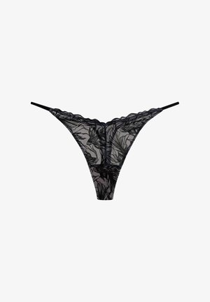 Schwarzer Spitzen-Thong mit floralen Mustern, transparenter Stoff, gewellten Kanten und dünnen Trägern. Das Design betont eine minimalistische Ästhetik.