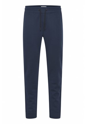 Dunkelblaue Jogginghosen aus weichem Stoff, mit einer Kordelzugtaille, schmal zulaufenden Beinen und gerippten Bündchen an den Knöcheln.