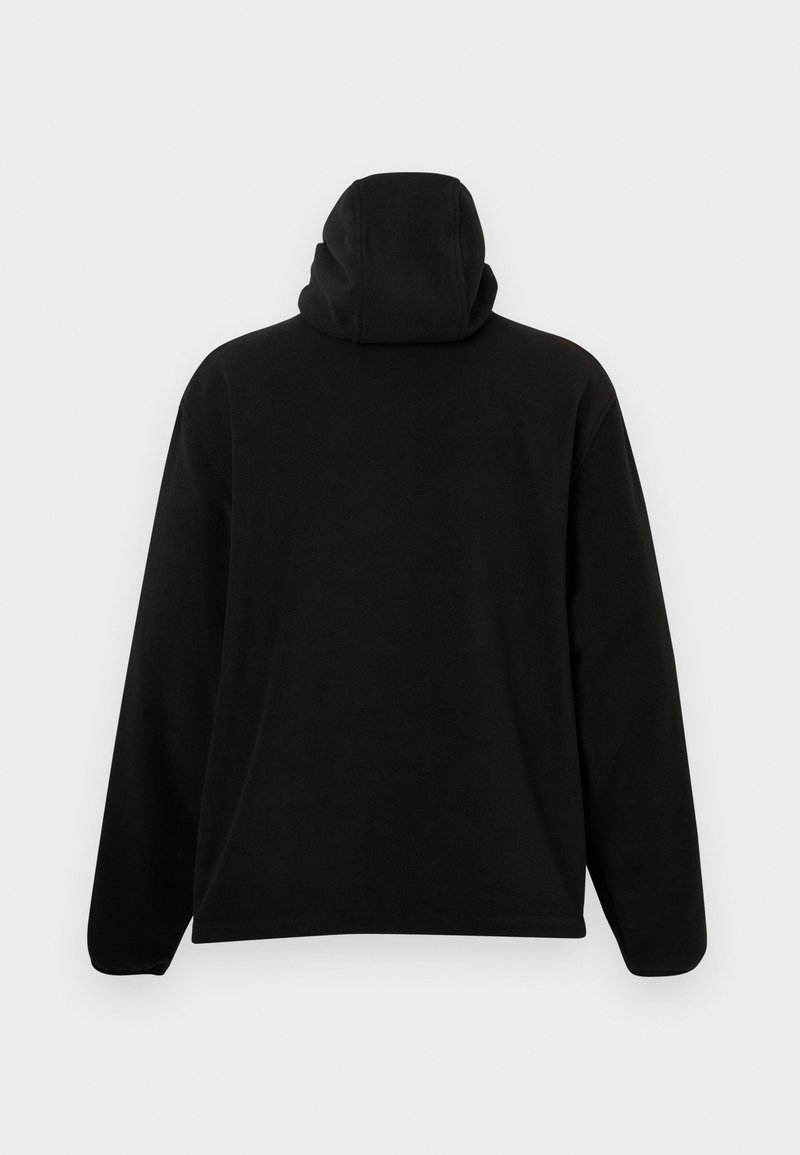 Sweatshirt à capuche noir avec une texture douce, coupe ample et manches longues, doté d'un col montant et sans logos ni motifs visibles.