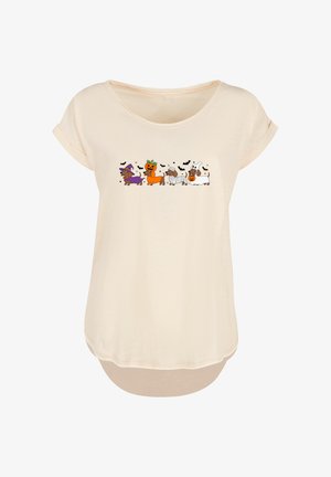 Light beige t-shirt with short sleeves and a rounded neckline. Features a colorful cartoon print of dogs in Halloween costumes across the front.