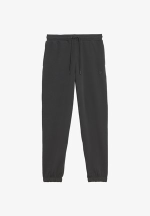 Schwarze Jogginghose mit elastischem Bund, Kordelzug, seitlichen Taschen, elastischen Bündchen und kleinem gesticktem Logo am linken Oberschenkel.