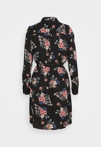 Robe noire à manches longues avec imprimé floral rose, bleu et blanc, un col et une ceinture nouée à la taille, vue de dos.