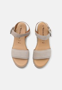 Light gray suede sandals with two wide straps, a buckled ankle strap, and a textured beige sole. Size indicated as 37 on the insole.