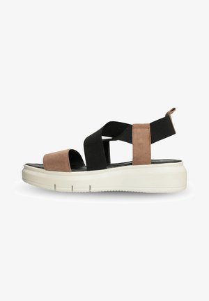 Sandalo in suede nero e marrone con una spessa suola piattaforma bianca, dotato di ampie cinghie incrociate e di un pratico tab per il rilascio sul retro.