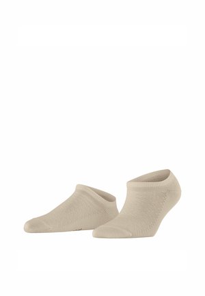 Paire de chaussettes beige basses à la cheville avec un motif en maille texturée, présentées sur un fond blanc.