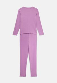 Purple long-sleeve top and matching leggings made of soft fabric. Top features a round neck and frilled edges; leggings are fitted.
