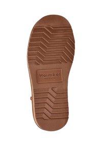 Bruine rubberen zool met een zigzagprofiel en het "Warmbat Australia" logo ingebed in het midden.