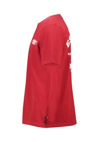 Red cotton t-shirt with short sleeves, featuring white text and a logo. The design is simple with a straight cut and a crew neck.