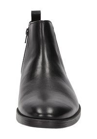 Bottines en cuir noir avec une finition lisse, bout rond, fermeture éclair sur le côté et semelle en caoutchouc plate et basse. Équipées d'une languette au talon.