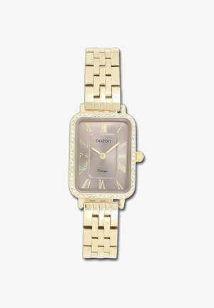 Montre rectangulaire en or avec un cadran champagne, des chiffres romains et des accents en cristal sur la lunette. Design de bracelet à maillons, finition en métal poli.