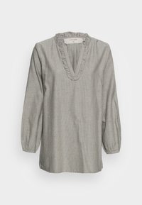 Blusa a righe grigia e bianca con scollo arricciato, maniche lunghe a palloncino e vestibilità rilassata. Presenta un motivo a righe verticali su tutta la superficie.