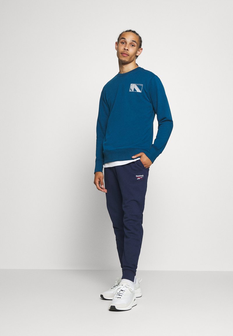 Femme Reebok Classic Vector Trail Trackpant Classic Vector Trail Pantalon de surv/êtement Pantalon de surv/êtement