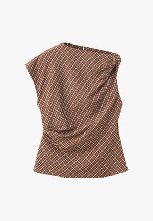 Blouse marron sans manches avec motif à carreaux blancs et léger détail drapé à l'avant.