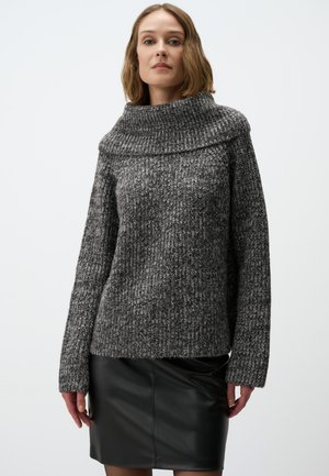 Chunky knit sweater in dark gray and black with a wide, folded collar and long sleeves, paired with a black leather skirt.