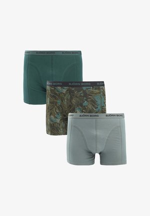 Drei Paare Herren-Boxershorts: eine einfarbige dunkelgrüne, eine mit dunklen grünen Blättern gemusterte und eine einfarbige hellgraue. Alle haben einen schwarzen Bund.
