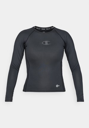 Sort langærmet træningsskjorte lavet af strækbart materiale, med rund halsudskæring og logo-detalje på brystet og i kanten.