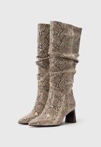 Tamaris Laarzen - beige snake