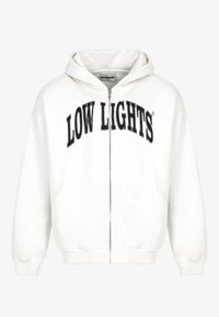 Sudadera blanca con cremallera hecha de un tejido suave, que presenta una gran impresión en negro "LOW LIGHTS" en el pecho y bolsillos laterales.