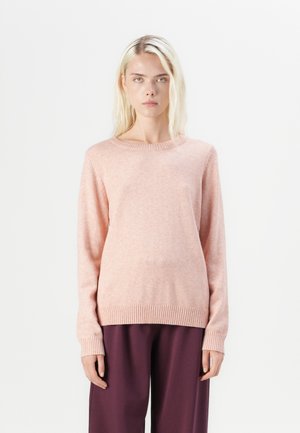 Light pink knit sweater with a crew neckline, long sleeves, and ribbed hem and cuffs, paired with loose dark purple trousers.