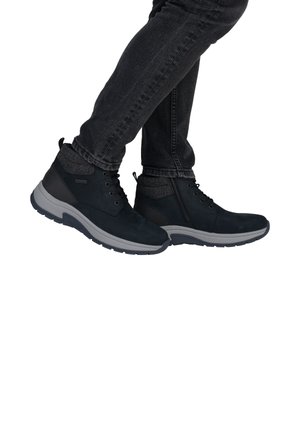 Black suede ankle boots with grey accents, lace-up design, and a textured collar. Rubber sole with a curved silhouette.