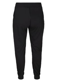 Pantaloni da jogging neri realizzati in tessuto morbido, con vita elastica, orli cuffed e tasche laterali. Design semplice e senza cuciture.
