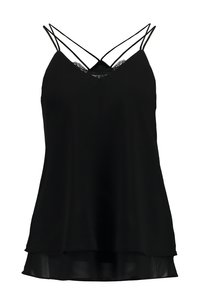 Svart linne med V-ringning, spetsdetaljer och dubbel spaghetti-axelrem. Tillverkat av ett lätt tyg med en flödande silhuett.