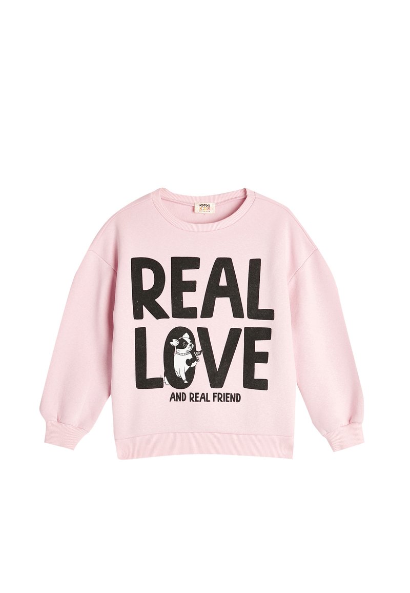 Rosa bomullströja med rundad hals, sänkta axlar, fet svart text som säger "VERKLIG KÄRLEK" och en grafik av en hund, ribbade manschetter och nederkant.