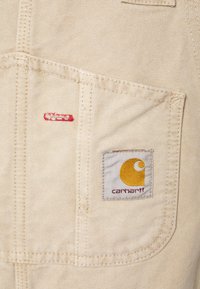 Carhartt WIP BIB OVERALL - Macacão de ganga - dusty brown faded