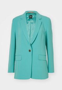 Tyrkysový blazer s jedním zlatým knoflíkem, dvěma předními kapsami a vzorovanou podšívkou. Přizpůsobený střih s klasickým klopovým designem.