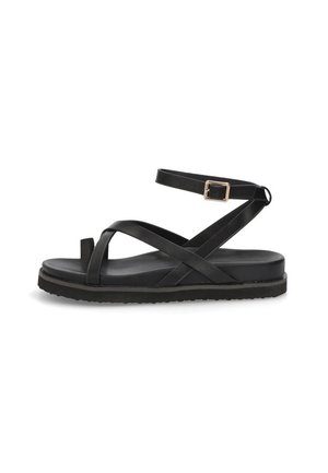 Sandalias negras de cuero suave que presentan múltiples tiras cruzadas, una correa para el tobillo con una hebilla dorada y una suela plana.