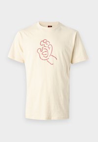 Crème Korte Mouwen T-shirt van katoen, met een roze omtrek van een hand op de voorkant. Eenvoudig, ontspannen pasvorm ontwerp.