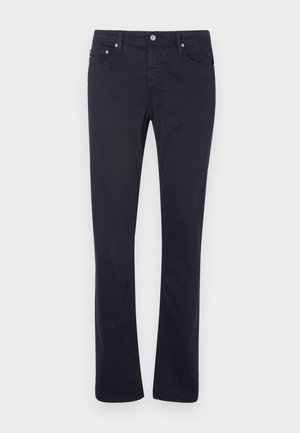 Pantalones de algodón azul marino con un diseño de pierna recta, que cuentan con bolsillos frontales, cremallera y detalles de herrajes metálicos.