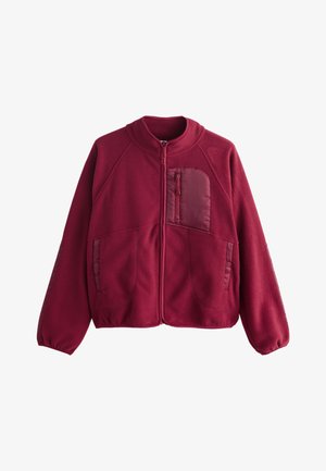 Bordeauxrote Fleecejacke mit durchgehendem Frontreißverschluss, elastischen Bündchen, zwei Seitentaschen mit Druckknöpfen und einer Reißverschlusstasche auf der Brust mit glatter Stoffblende.