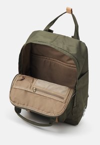 Green fabric backpack with a brown interior. Zippered compartment and mesh pocket inside. Two top handles for carrying.