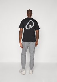 The North Face SIMPLE DOME REGULAR TAPERED JOGGER - Tracksuit bottoms - medium grey heather