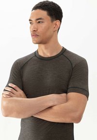Short-sleeve athletic shirt in dark gray textured fabric, featuring raglan sleeves and contrasting blue stitching along the seams.