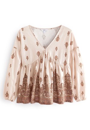 Beżowa bluzka na długi rękaw z dekoltem w serek, wzory kwiatowe i paisley w brązowych odcieniach, marszczona talia i elastyczne mankiety.