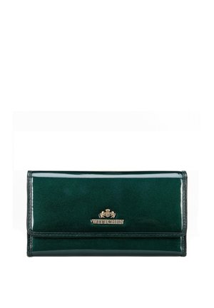 Green leather wallet with a glossy finish, featuring a gold-tone logo and a fold-over flap design. Smooth texture with clean lines.