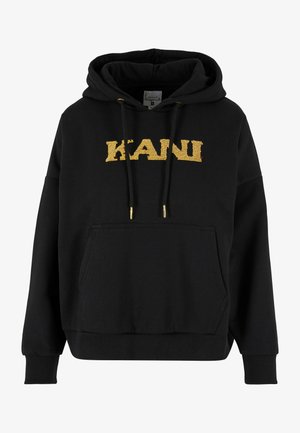 Haut à capuche noir avec une poche kangourou, orné d'un logo "KANI" brodé en or et de cordons avec des embouts dorés. Tissu doux, coupe décontractée.