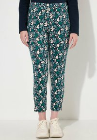 Pantaloni con motivo floreale in verde, blu e bianco, realizzati in tessuto leggero con vita elastica.