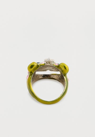 Green frog-shaped ring with glossy enamel finish, featuring pink accents and a silver band. Detailed with prominent eyes and a textured surface.