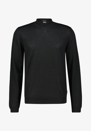 Pull en tricot noir avec un col haut, des manches longues et des poignets côtelés. Texture lisse, design simple et étiquette de logo sur le côté.