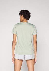 New Balance ESSENTIALS - Sportfelső - garter snake