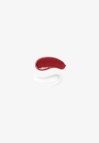 Two cosmetic cream smears on a white background, one deep red and glossy above a translucent white gel with bubbles.