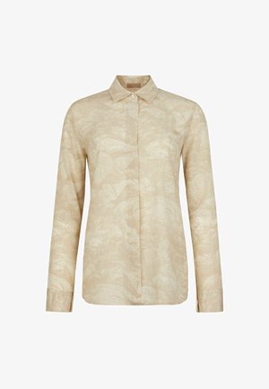 Beige overhemd met lange mouwen, subtiel bloemen- en bladmotief, puntkraag en verborgen knopen aan de voorkant.