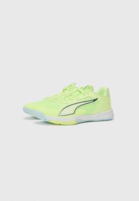 Neon yellow athletic shoes with mesh upper, white midsole, and light blue outsole. Features a black accent stripe and six lace eyelets.