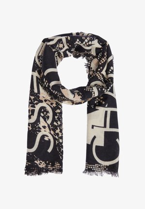 Black and beige patterned scarf with abstract geometric and animal print designs, fringed edges, loosely looped on a white background.