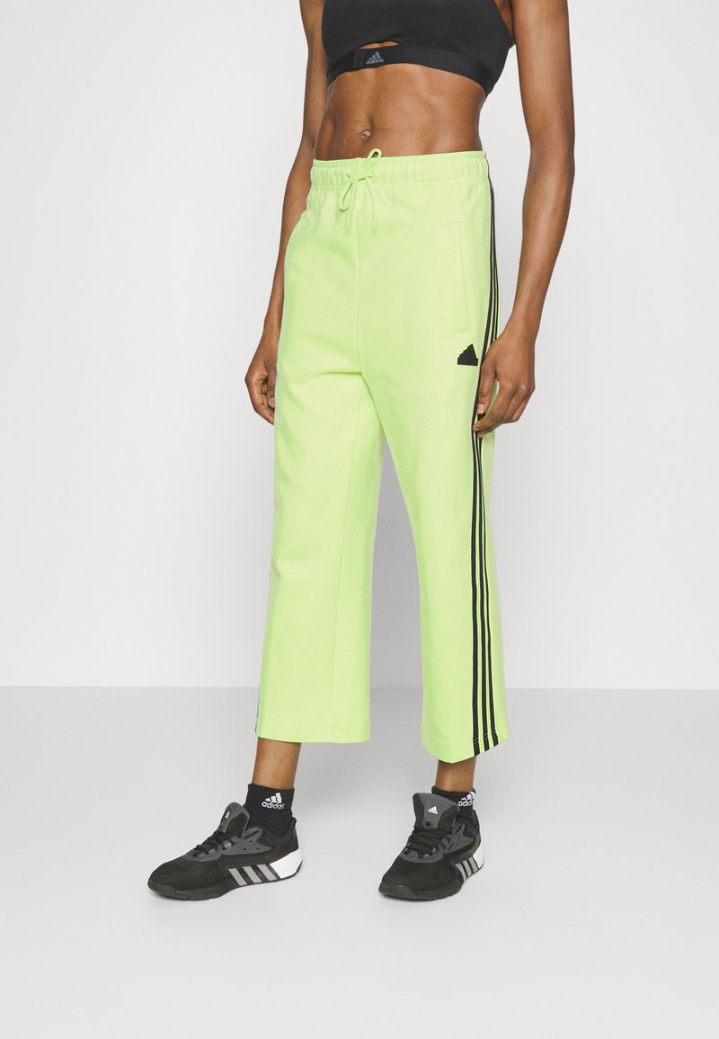 adidas Sportswear Tracksuit bottoms pulse lime/light green Zalando